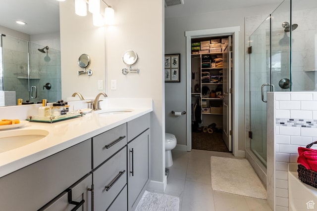 6065 N Westridge Rd, Heber City, UT 84032 - full bathroom featuring a sink, a walk in closet, a stall shower, and double vanity