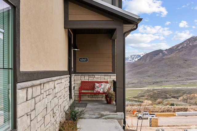 6065 N Westridge Rd, Heber City, UT 84032 - entrance to property featuring a porch, a mountain view, and stone siding
