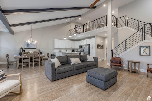 1089 W Cattail Ct, Kamas, UT 84036 - living room featuring beamed ceiling, stairs, light wood-style floors, baseboards, and high vaulted ceiling