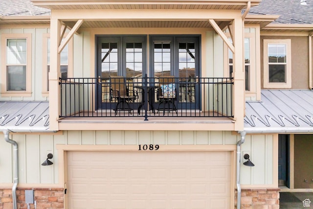 1089 W Cattail Ct, Kamas, UT 84036 - exterior space featuring an attached garage, a shingled roof, stone siding, and board and batten siding