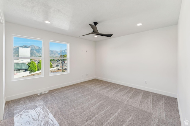 unfurnished room with a ceiling fan, carpet floors, baseboards, and recessed lighting