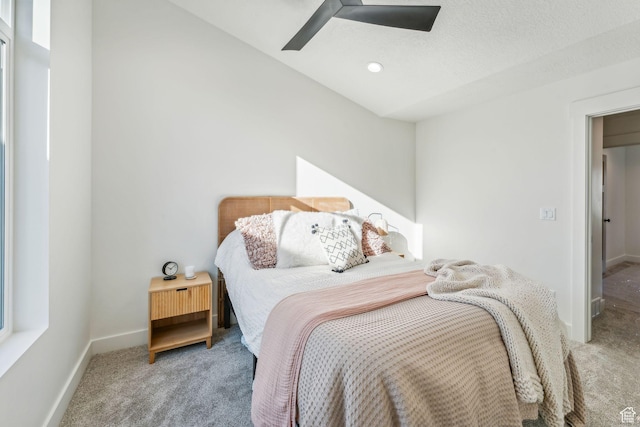 bedroom featuring carpet flooring, a ceiling fan, and baseboards