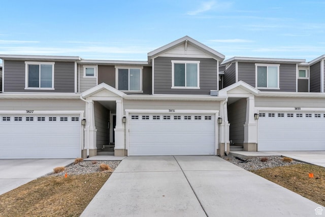 view of front of home with driveway and a garage