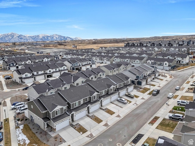 birds eye view of property featuring a mountain view and a residential view