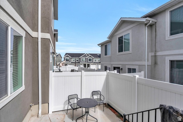 balcony with a residential view and a patio area