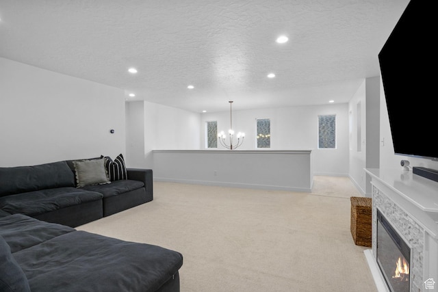 living room with recessed lighting, light carpet, a chandelier, and a textured ceiling