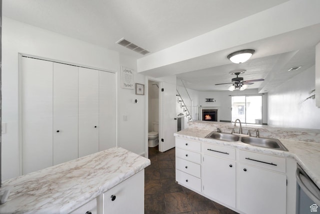 1418 W Telegraph Hill Dr, Taylorsville, UT 84123 - kitchen with light countertops, a sink, visible vents, dishwasher, and a ceiling fan