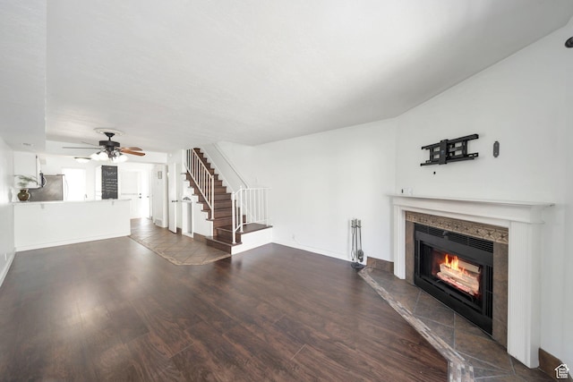 1418 W Telegraph Hill Dr, Taylorsville, UT 84123 - unfurnished living room with dark wood-style flooring, baseboards, stairs, a fireplace, and ceiling fan