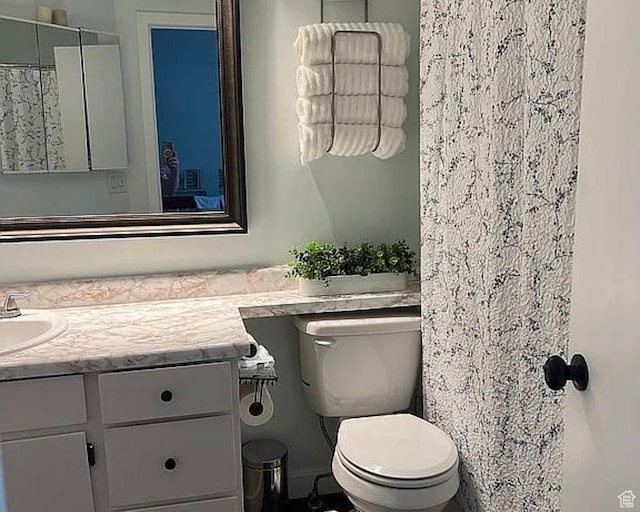 1418 W Telegraph Hill Dr, Taylorsville, UT 84123 - bathroom featuring toilet and vanity