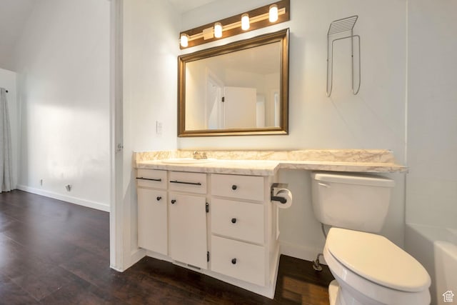 1418 W Telegraph Hill Dr, Taylorsville, UT 84123 - bathroom with a bath, baseboards, toilet, wood finished floors, and vanity