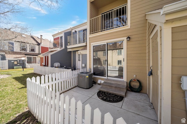 1418 W Telegraph Hill Dr, Taylorsville, UT 84123 - view of patio / terrace with a balcony, fence, and central AC