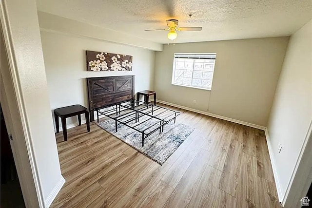 1598 Westbury Way Unit H, Lehi, UT 84043 - bedroom featuring baseboards, a textured ceiling, wood finished floors, and a ceiling fan