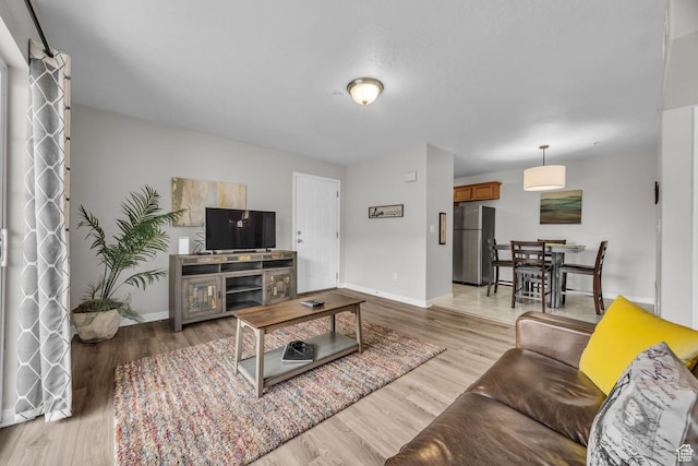 1598 Westbury Way Unit H, Lehi, UT 84043 - living room featuring light wood finished floors and baseboards