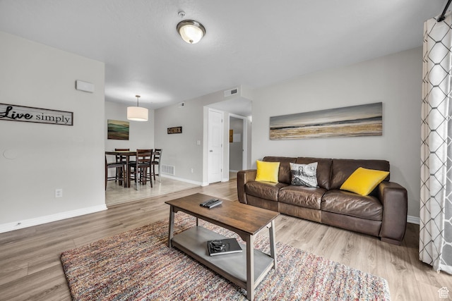 1598 Westbury Way Unit H, Lehi, UT 84043 - living area with baseboards, visible vents, and wood finished floors