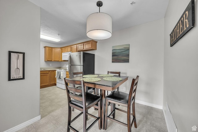 1598 Westbury Way Unit H, Lehi, UT 84043 - dining area featuring baseboards