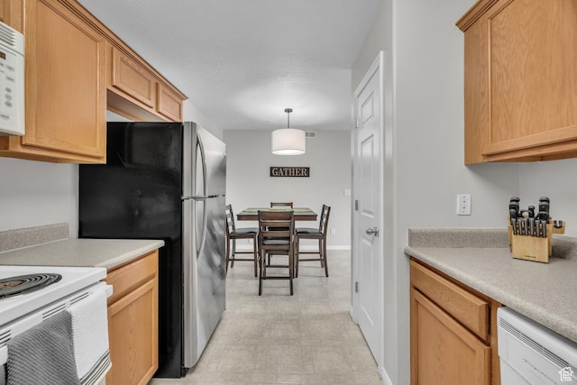 1598 Westbury Way Unit H, Lehi, UT 84043 - kitchen featuring hanging light fixtures, white appliances, and light countertops