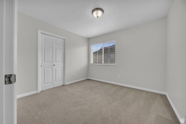 1598 Westbury Way Unit H, Lehi, UT 84043 - unfurnished room with baseboards, carpet floors, and a textured ceiling
