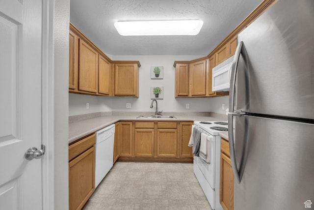 1598 Westbury Way Unit H, Lehi, UT 84043 - kitchen with a textured ceiling, light countertops, a sink, and white appliances