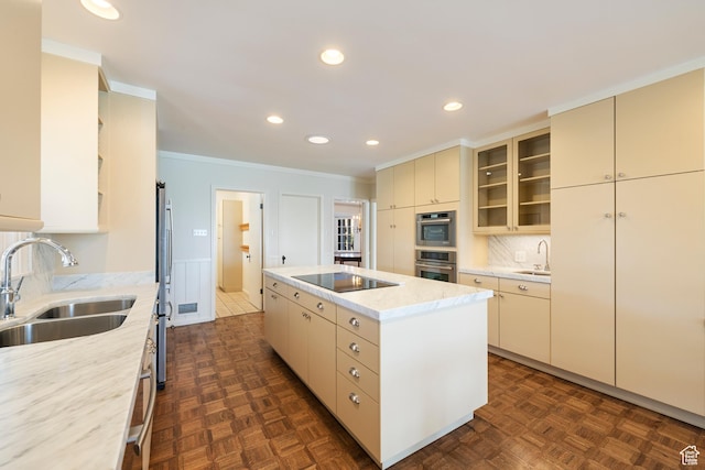 2532 E Maywood Dr, Salt Lake City, UT 84109 - kitchen with a kitchen island, cream cabinets, a sink, and stainless steel appliances
