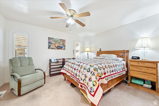 180 N 1100 E Unit 24, Washington, UT 84780 - carpeted bedroom with a ceiling fan and baseboards