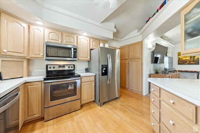 180 N 1100 E Unit 24, Washington, UT 84780 - kitchen with light countertops, appliances with stainless steel finishes, and light brown cabinets
