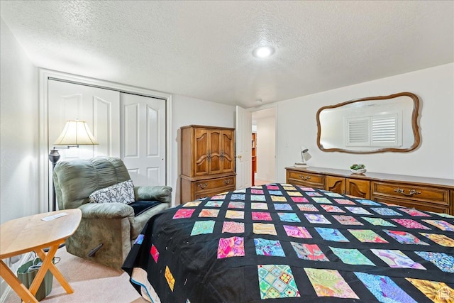 180 N 1100 E Unit 24, Washington, UT 84780 - carpeted bedroom with a closet and a textured ceiling