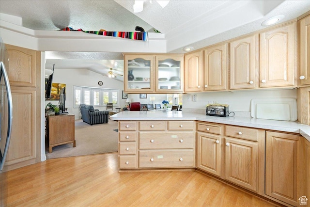 180 N 1100 E Unit 24, Washington, UT 84780 - kitchen with light countertops, light brown cabinetry, vaulted ceiling, and ceiling fan