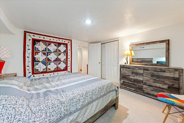 180 N 1100 E Unit 24, Washington, UT 84780 - bedroom with a closet, carpet flooring, and a textured ceiling