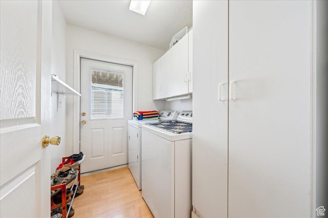 180 N 1100 E Unit 24, Washington, UT 84780 - washroom featuring cabinet space, light wood-style flooring, and washer and dryer