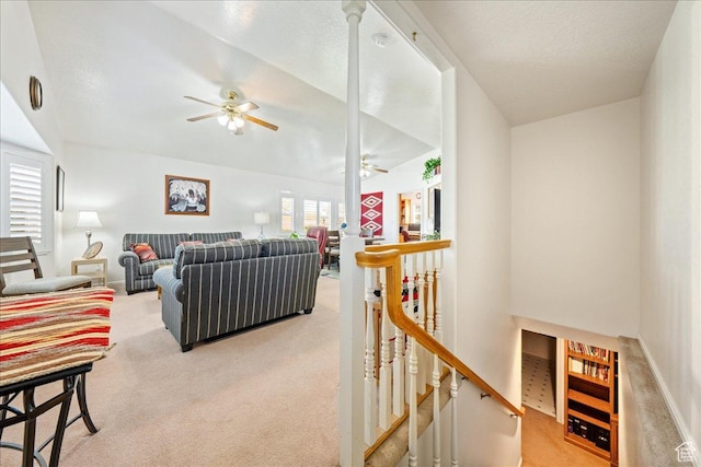 180 N 1100 E Unit 24, Washington, UT 84780 - living room with baseboards, a textured ceiling, a ceiling fan, and light carpet