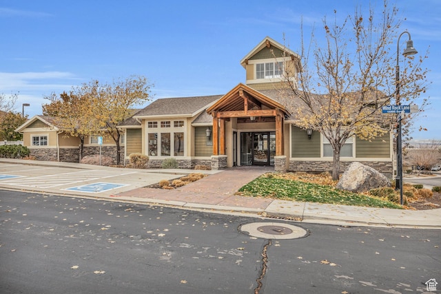 5116 W Rock Butte Rd, Herriman, UT 84096 - view of front facade with stone siding and roof with shingles