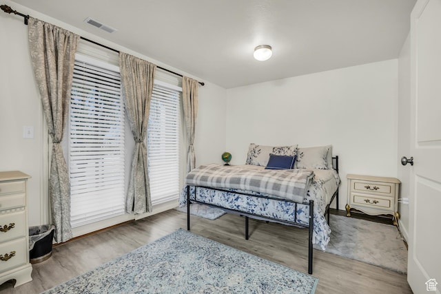5116 W Rock Butte Rd, Herriman, UT 84096 - bedroom featuring visible vents and wood finished floors