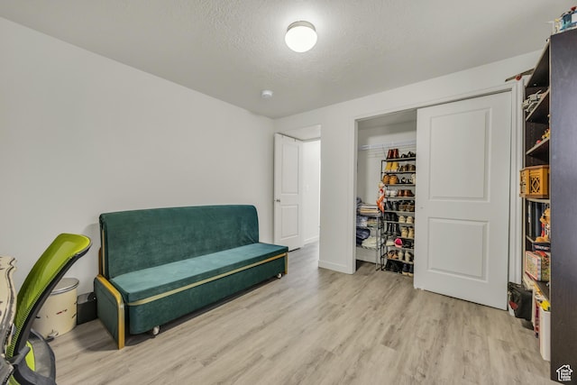 5116 W Rock Butte Rd, Herriman, UT 84096 - sitting room with wood finished floors and a textured ceiling