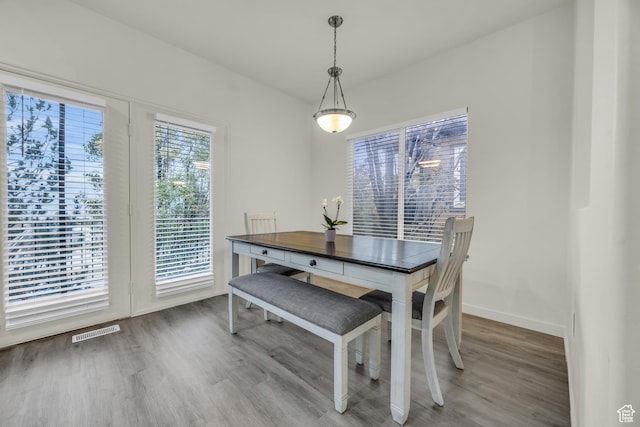 5116 W Rock Butte Rd, Herriman, UT 84096 - dining area with baseboards, visible vents, and wood finished floors