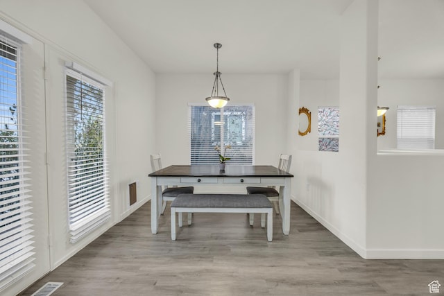 5116 W Rock Butte Rd, Herriman, UT 84096 - dining space featuring baseboards, visible vents, and wood finished floors