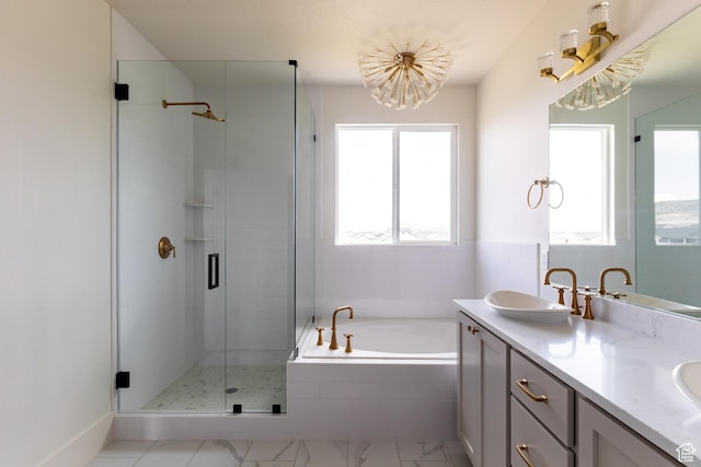 bathroom featuring a bath, a sink, a healthy amount of sunlight, and a shower stall