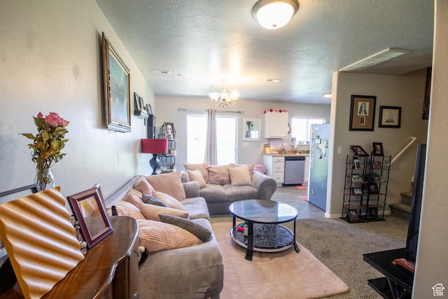 669 E 1375 S, Vernal, UT 84078 - living area featuring a textured ceiling, a chandelier, stairway, carpet flooring, and baseboards