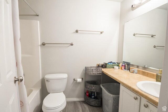669 E 1375 S, Vernal, UT 84078 - full bathroom with vanity, toilet, wood finished floors, shower / bath combination, and baseboards