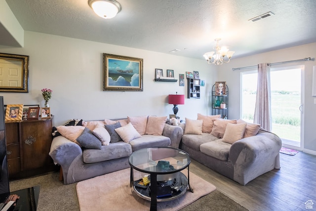 669 E 1375 S, Vernal, UT 84078 - living area featuring a textured ceiling, a chandelier, and wood finished floors