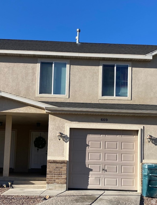 669 E 1375 S, Vernal, UT 84078 - view of front of property featuring stucco siding, brick siding, and a garage