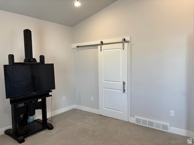 12038 S Middle Teton Dr Unit 134, Herriman, UT 84096 - bedroom with lofted ceiling, a barn door, carpet floors, and baseboards