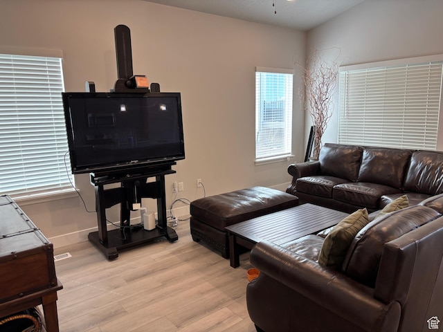 12038 S Middle Teton Dr Unit 134, Herriman, UT 84096 - living area with light wood-style flooring, ceiling fan, and baseboards