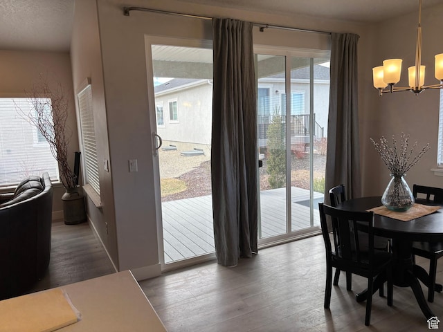 12038 S Middle Teton Dr Unit 134, Herriman, UT 84096 - dining room featuring a chandelier and wood finished floors
