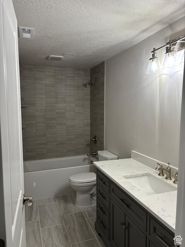 12038 S Middle Teton Dr Unit 134, Herriman, UT 84096 - full bathroom featuring vanity, toilet, a textured ceiling, and shower / bathtub combination