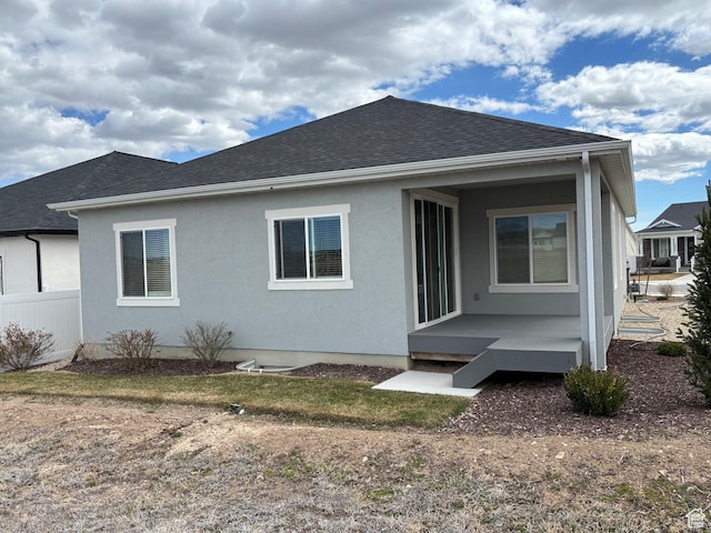 12038 S Middle Teton Dr Unit 134, Herriman, UT 84096 - rear view of property with roof with shingles and stucco siding
