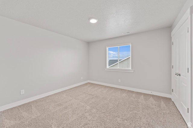 unfurnished bedroom featuring baseboards and carpet