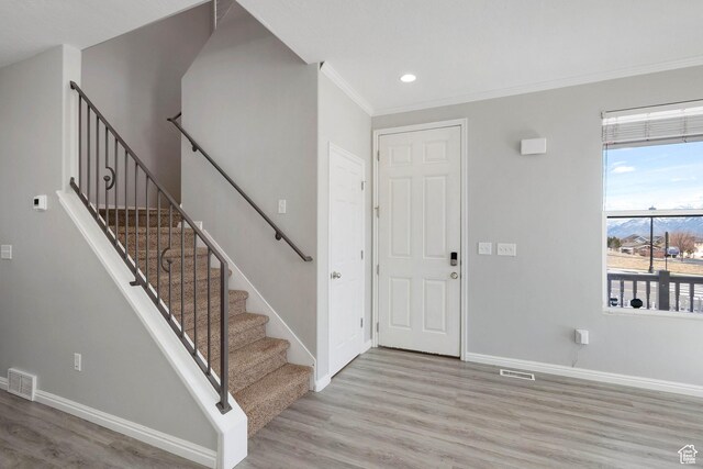 4988 W Currant Dr, South Jordan, UT 84009 - foyer with light wood finished floors, baseboards, crown molding, stairs, and recessed lighting