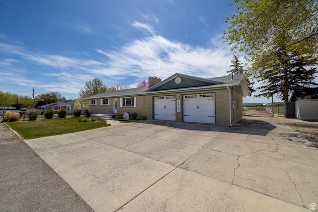 ranch-style house featuring driveway, a chimney, brick siding, fence, and an attached garage