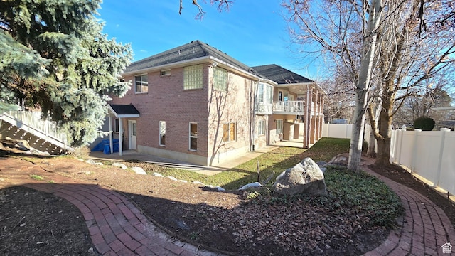 362 S Glen Cir, Fruit Heights, UT 84037 - rear view of property featuring brick siding, a fenced backyard, roof with shingles, and a patio area