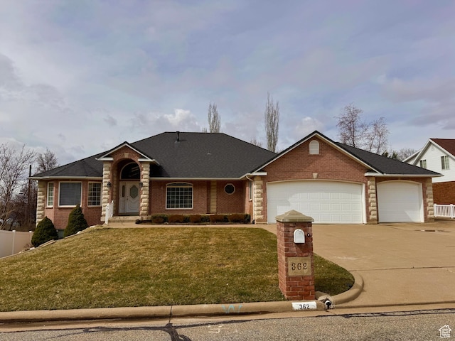 362 S Glen Cir, Fruit Heights, UT 84037 - view of front of home featuring brick siding, concrete driveway, a front lawn, and an attached garage